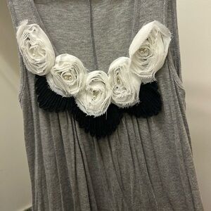 Pretty Gold grey tunic with black and white rosettes.